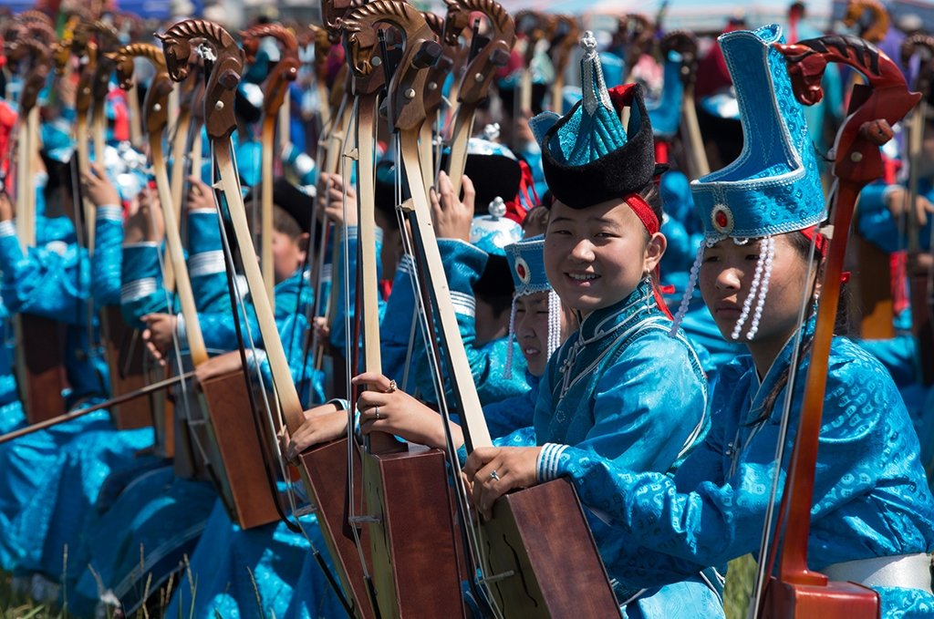 Young horse head fiddle musicians preparing for the opening ceremony of the local Naadam Festival in Bulgan Province, northern Mongolia during a Mongolia small group experiences