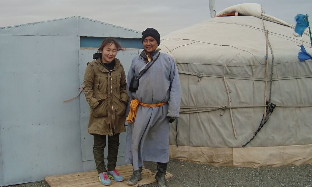 A young herding family outside their ger in the district of Bayandalai in Mongolia's southern Gobi - close to Gobi Gurvan Saikhan National Park