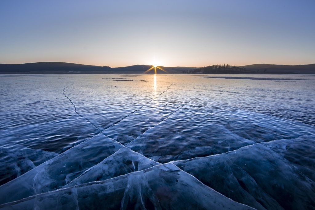 sunrise over frozen lake Khuvsgul in northern Mongolia