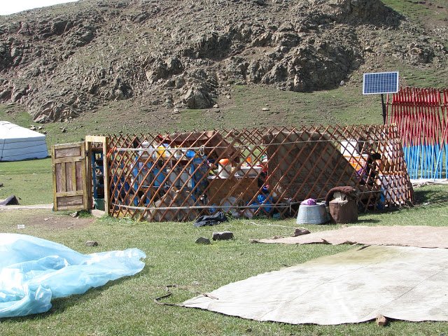 A ger being collapsed prior to a herding family migrating 