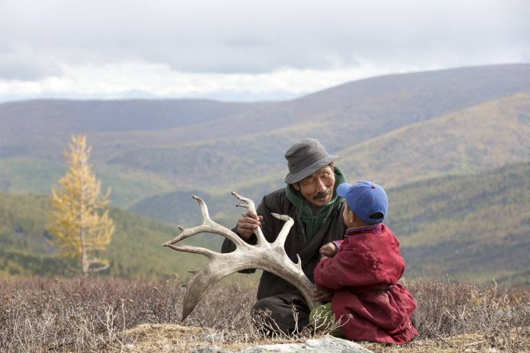 Mongolian Tsaatan reindeer herder in taiga