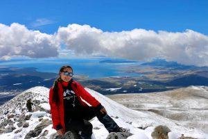 Pujee - a Eternal Landscapes trip assistant - woman achieving new heights on top of Monkh Saridag Mountain .