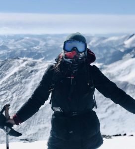 Pujee - a Eternal Landscapes trip assistant - woman achieving new heights on top of Asralt Khairkhan Mountain .