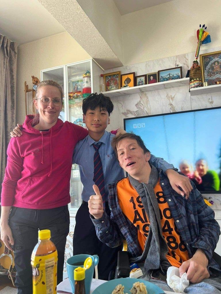 A wheelchair user visiting a family home in Mongolia