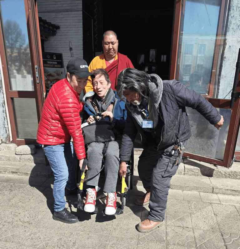 A wheelchair user visiting Gandan Monastery  in our accessible travel in Mongolia