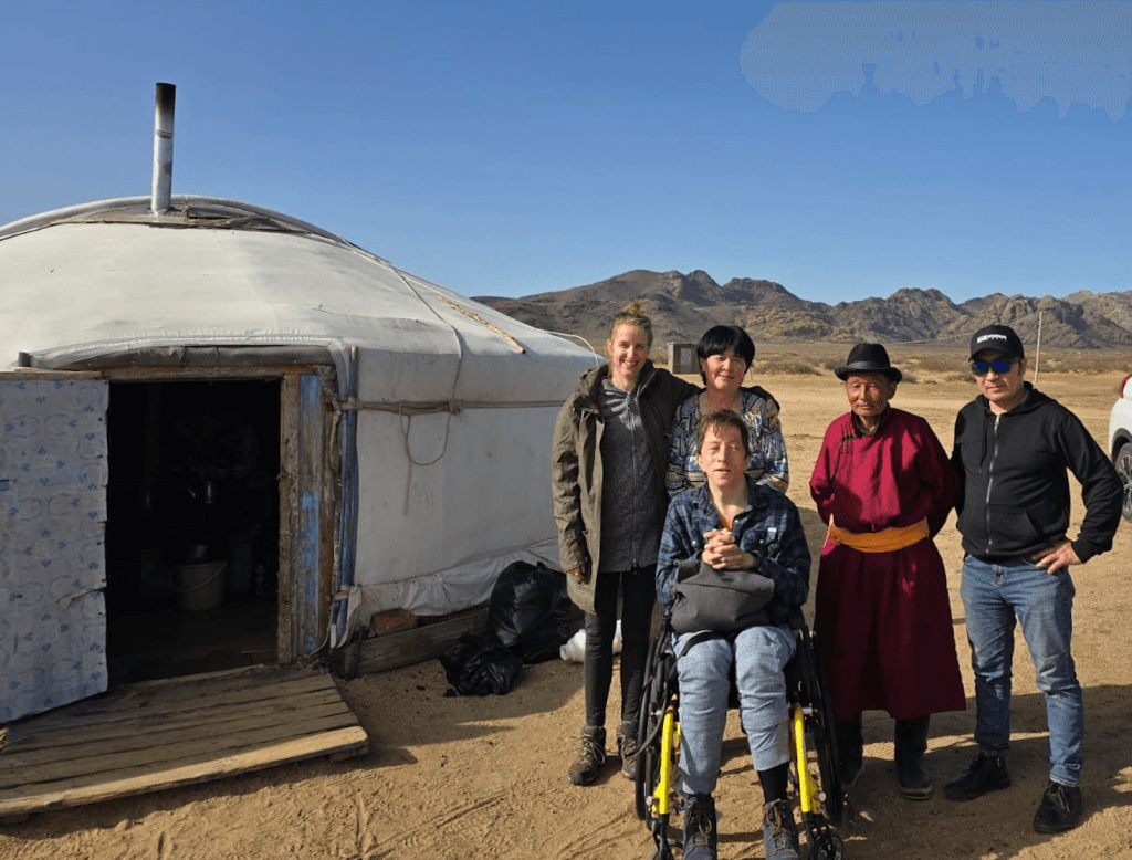 Wheelchair user with a Mongolian herding family